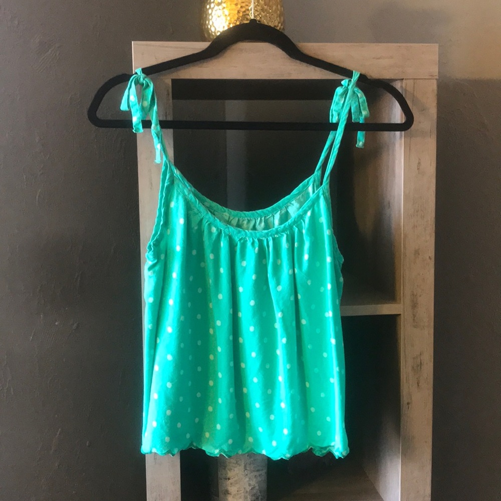 Green polka dotted blouse.